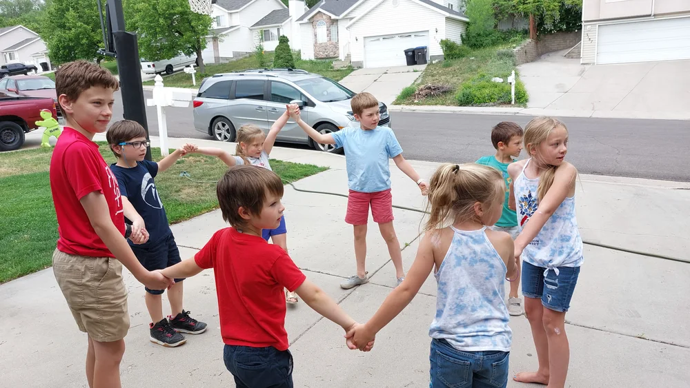 Children creating music together outdoors