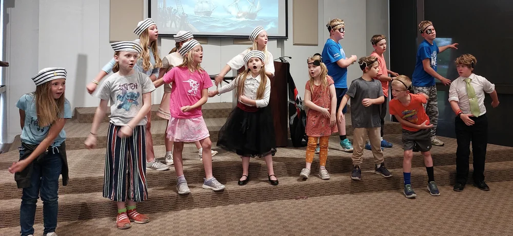 Students performing together for family and friends